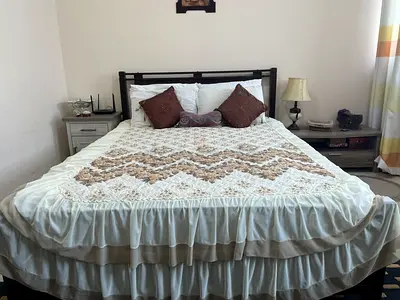 Wooden double bed frame with clean mattress and side table - used, good condition