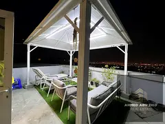 Two bedrooms, a living room, a master bedroom, three bathrooms, a balcony with a large 3700 sq ft ro