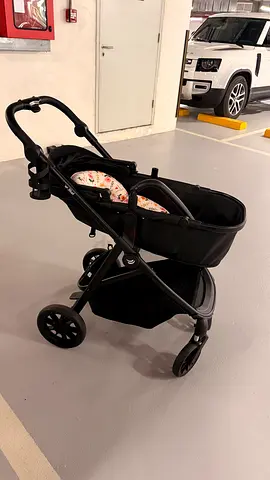 Pram-style stroller with removable bassinet — good condition