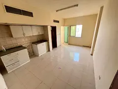 Studio for annual rent in Al Rawda, Ajman, with a balcony and excellent view, spacious and practical