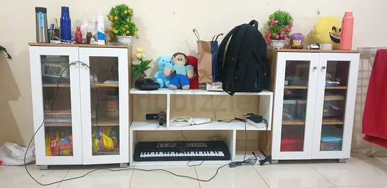 White entertainment unit with glass-door cabinets and open shelves (used)