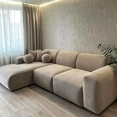 Beige L-shaped sectional sofa with chaise