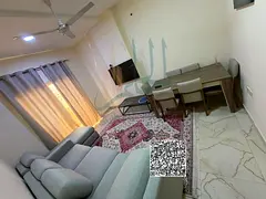 For monthly rent: a furnished one-bedroom apartment with a living room in Al Rawda area, Ajman.