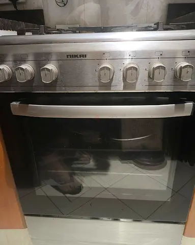 Nikai freestanding gas range with oven and hob, grill function. Only 1 year use.