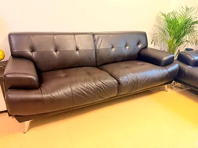 Set of two dark brown leather sofas — modern, good condition (3 and 2 Seater)