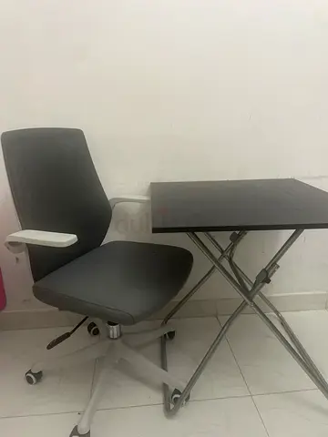 My compact grey swivel chair with folding computer desk