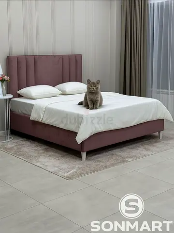 Upholstered bed frame with padded headboard - mauve/pink