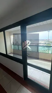 Two-bedroom apartment with a living room, a maid's room, and an open view in Al Majarra