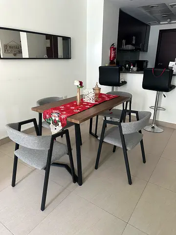 Modern 4-seater dining table with grey upholstered chairs