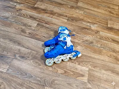 My blue inline roller skates — used pair with adjustable straps