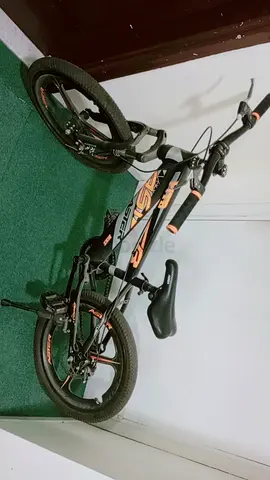 My childs black  orange BMX-style bike - good condition