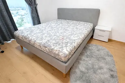 My grey upholstered bed