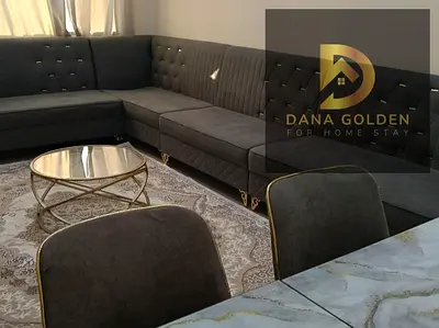 Two bedrooms and a living room / Furnished with hotel-style furniture / Al Taawun