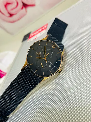 Obaku denmark featuring a black stainless steel mesh band, a round gold-coated , multifunction