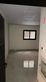 For rent in Muwaileh opposite the park: brand new studio, elegant design, semi-closed kitchen, free