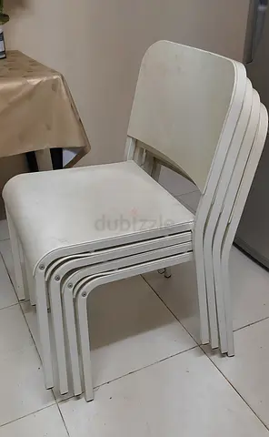Set of 4 white stackable chairs - IKEA MELLTORP chairs