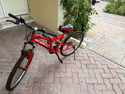 Red mountain bike (used) — good working condition