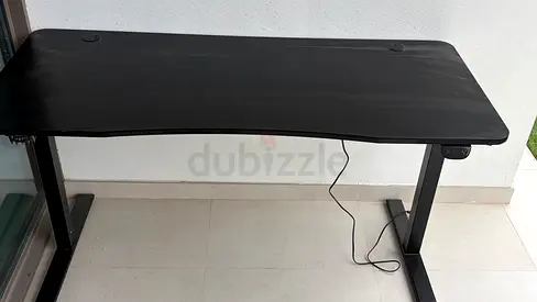 Black electric height-adjustable standing desk - good condition 140x60