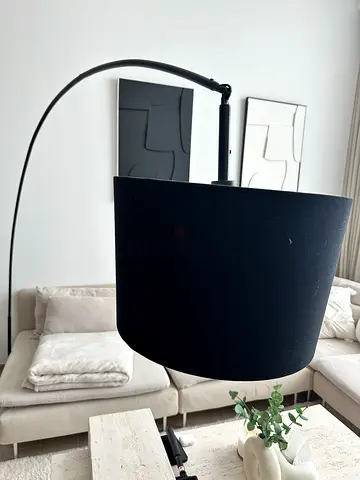 Black arched floor lamp with large drum shade