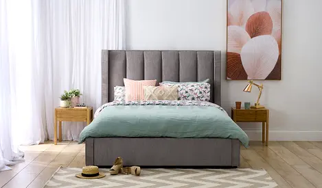 My grey upholstered double bed with padded headboard