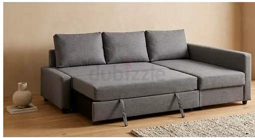 Selling my gray L-shaped sofa bed with storage
