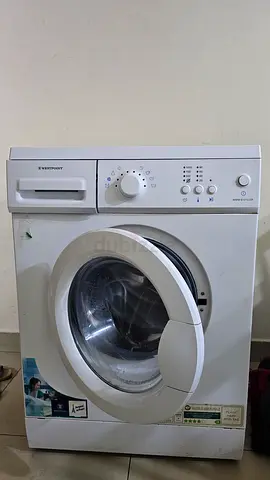 Used front-load washing machine — drum shown