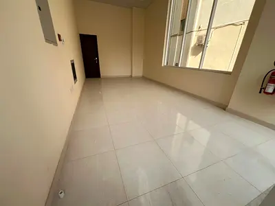 First-tenant shop in Al Nubai’a, new building, internal bathroom, AED 18,000 yearly, 4 payments, ready for immediate business use.