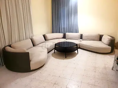 Curved modular 5-seater sofa — beige and grey, good condition