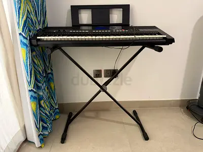 Lightly used electronic keyboard with X-stand