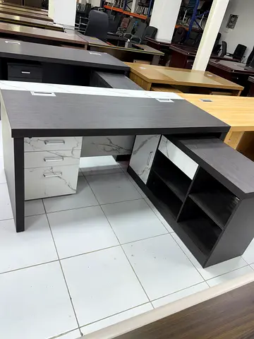 L-shaped office desk with storage and marble-look cabinets