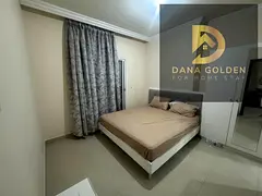 tTwo bedrooms, a living room, and a maid's room for rent in Sharjah Al Taawun