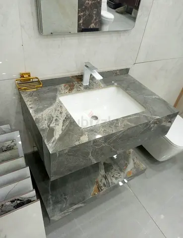 My grey marble bathroom vanity unit with built-in sink and shelf