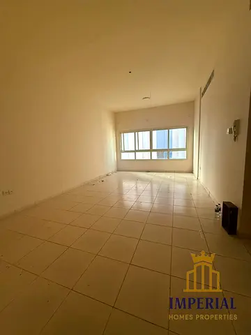 A studio flat with a separate kitchen, a balcony off the kitchen, and central air conditioning, located near the bus station