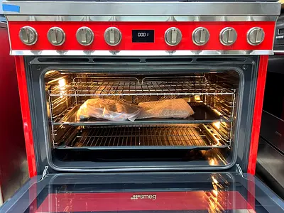 My red SMEG freestanding range oven — used and working