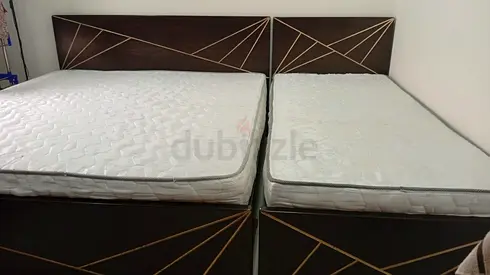 Excellent condition queen size bed and single bed 1 year old taken by home centre, smoke/Pet Free.