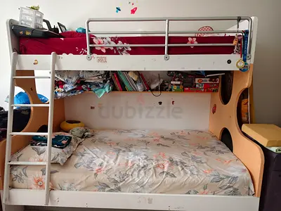 Bunk bed metal loft bed with two mattress and red bedding - used