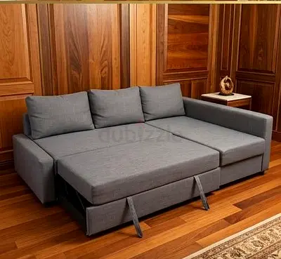My gray L-shaped convertible sofa bed with pull-out trundle