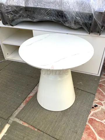 Round white marble-effect side table