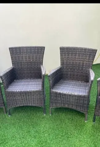 Pair of rattan-style outdoor armchairs — used, good condition