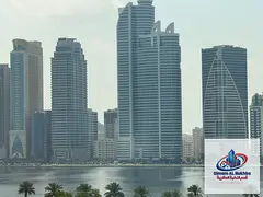 For annual rent: Three-bedroom apartment with a living room in Al Majaz 1 area. Spacious, with an op