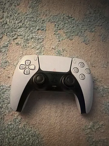 Selling a PlayStation 5 DualSense controller in good condition. Everything works well, with only ver
