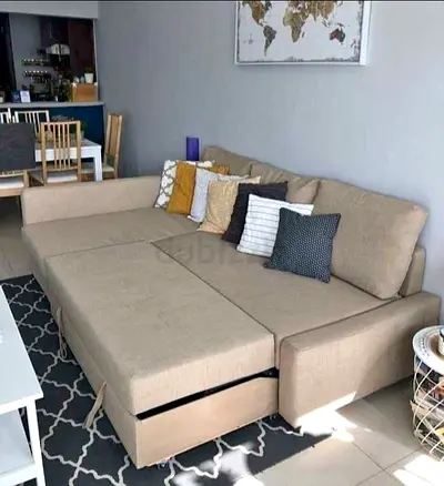 beige L-shaped  sofa bed with storage  good conditions