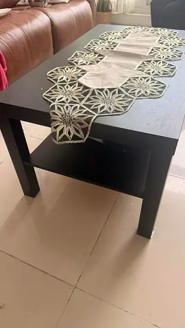 Black coffee table with lower shelf - used, good condition