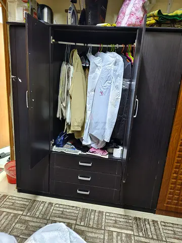 Dark wood wardrobe/armoire with 3 drawers and hanging rail