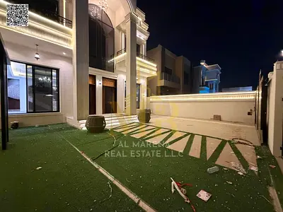 Two-story villa with a rooftop terrace in Al Aaliyah, price includes electricity, water, and central air conditioning. Located on the main street, rea