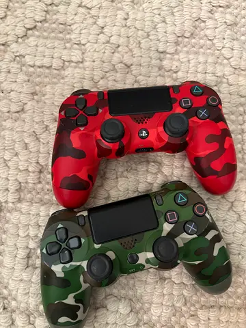 Red and Green Camouflage PlayStation Controllers
