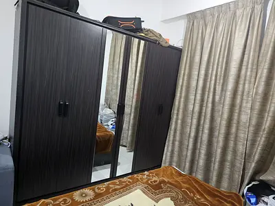 Dark wood 4-door wardrobe with center mirror