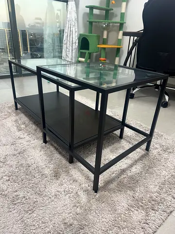 Ikea Modern glass coffee table - black metal frame with lower shelf