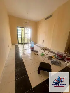 The best and most affordable two-bedroom apartment with a living room in Al Qasimia, featuring centr