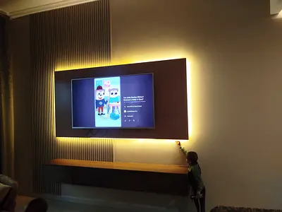 Tv wall design with PVC panels LED and consule table